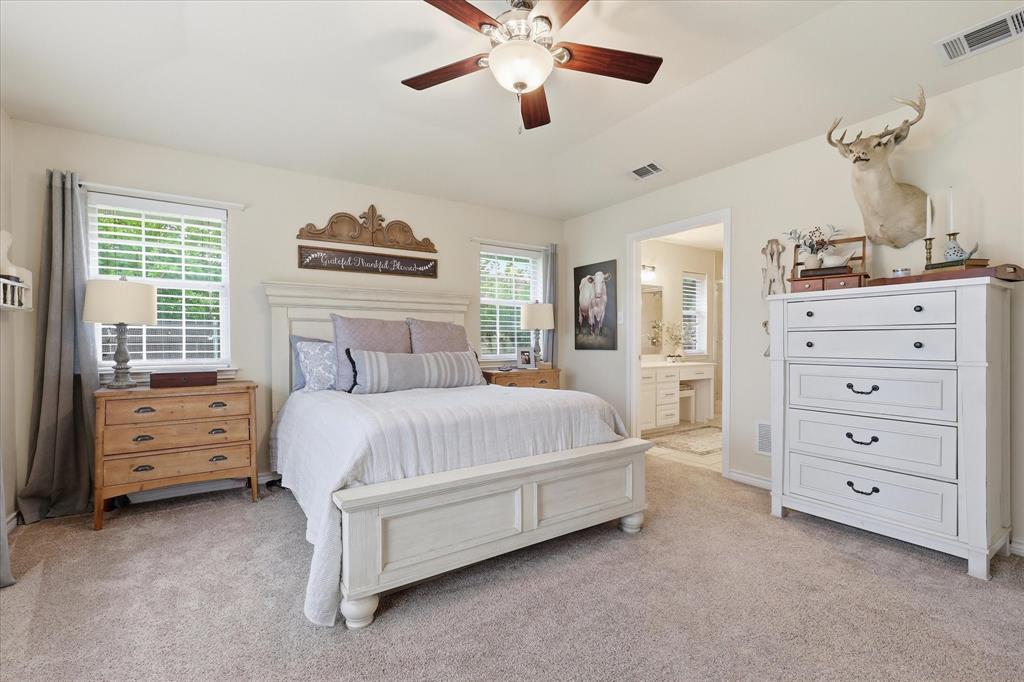 202 Colonial Heights Sanger, TX 76266 - Photo 14 of 27 a bedroom with a bed dresser and a window