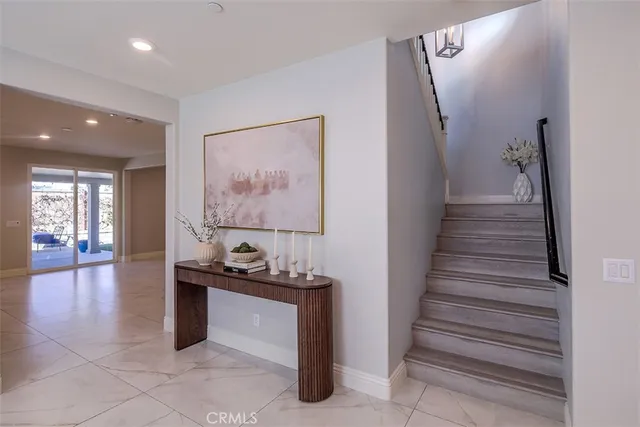 a view of entryway and hall with wooden floor