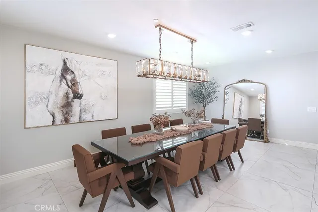 a view of a dining room with furniture window and outside view