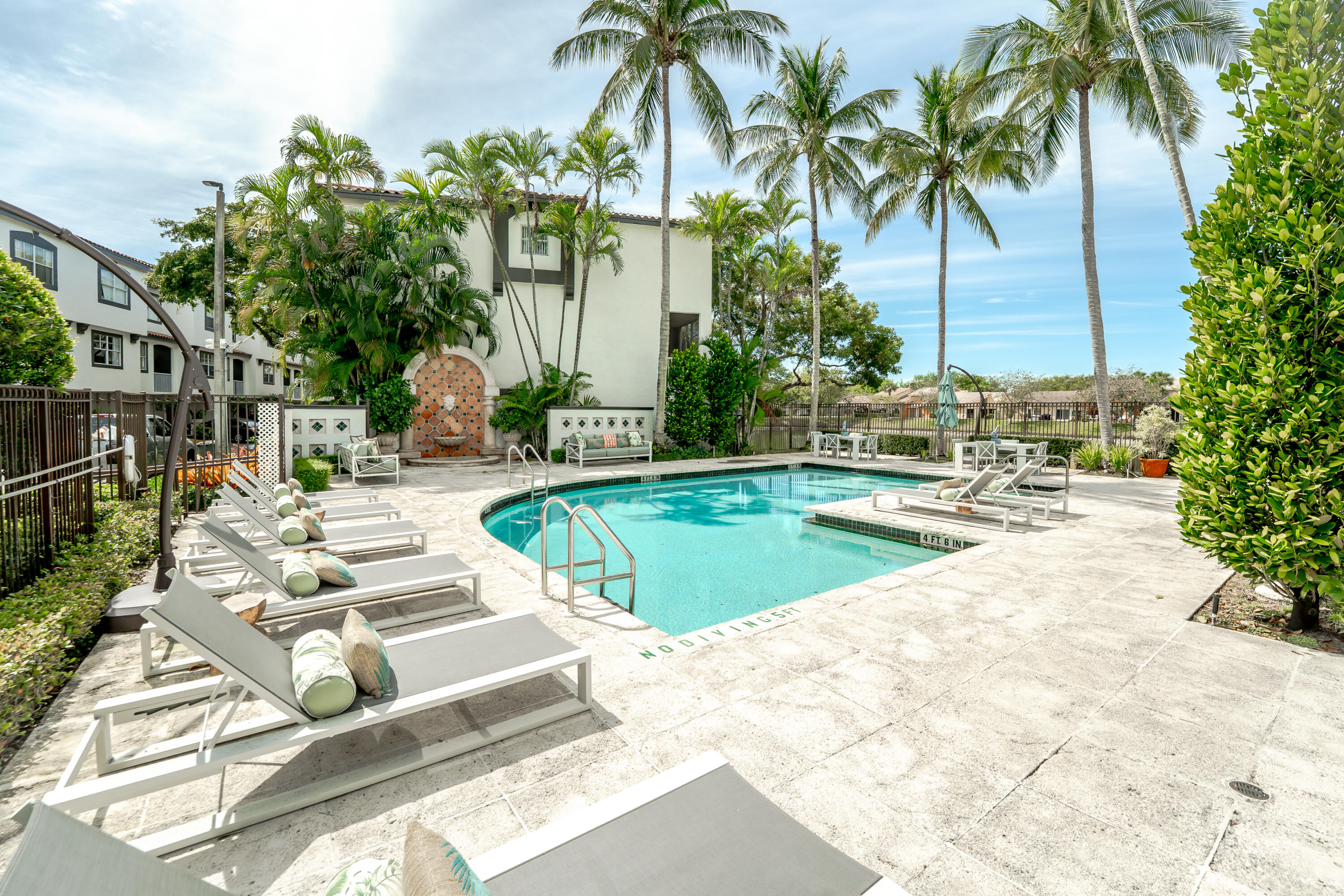 20889 St Andrews Boulevard Boca Raton, FL 33433 - Photo 39 of 46 a view of a swimming pool with a patio