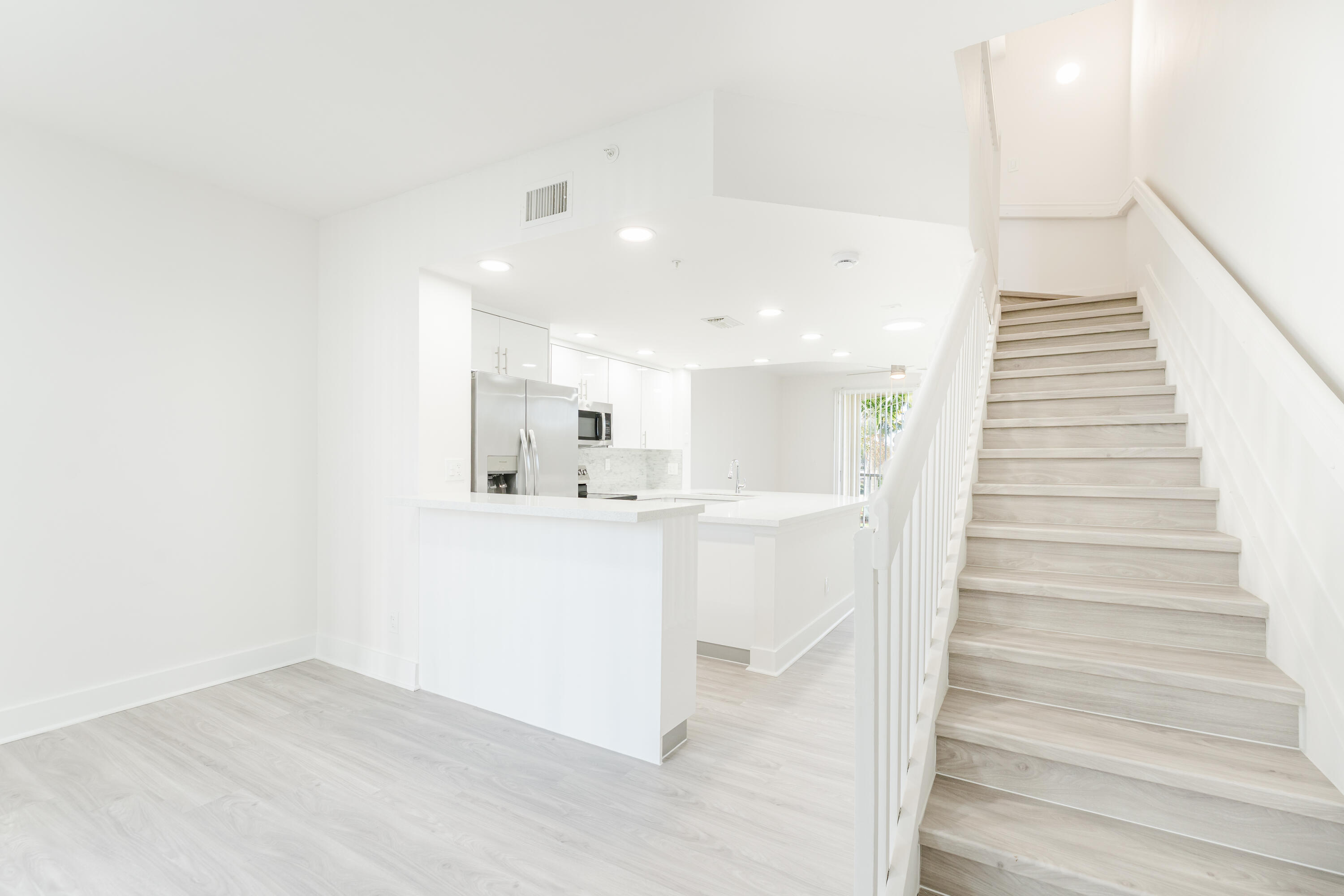 20889 St Andrews Boulevard Boca Raton, FL 33433 - Photo 10 of 46 a view of entryway and hall with wooden floor
