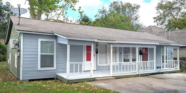 front view of a house with a large window
