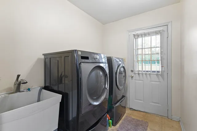 a utility room with dryer and washer