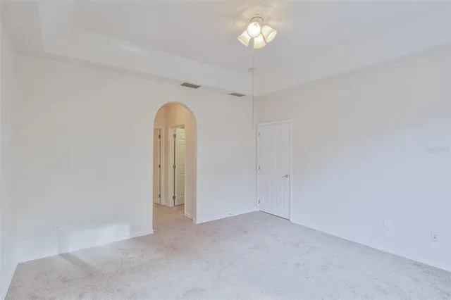 an empty room with a empty space and a window