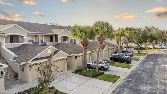 a view of multiple houses with yard