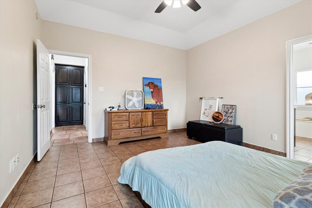 6005 Hawkeye Road Krum, TX 76249 - Photo 15 of 27 Room with neutral-toned walls, tile flooring, and a ceiling fan