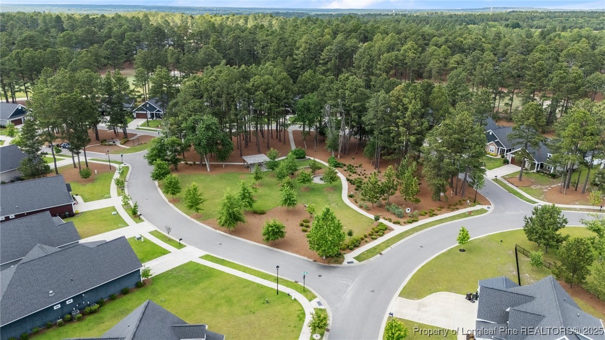479 Kerr Lake Road Aberdeen, NC 28315 - Photo 39 of 43 an aerial view of a swimming pool with outdoor seating and yard
