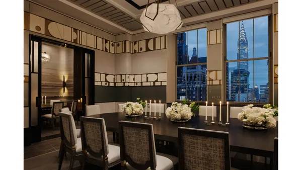 a view of a dining room with furniture wooden floor and chandelier