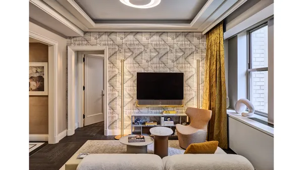 a living room with furniture and a rug