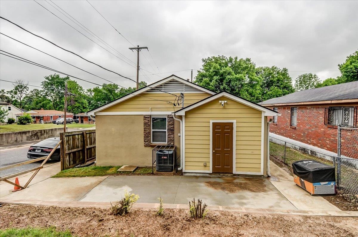 1411 Roberts Road Memphis, TN 38106 - Photo 24 of 24 Single-story exterior featuring tan stucco and horizontal siding