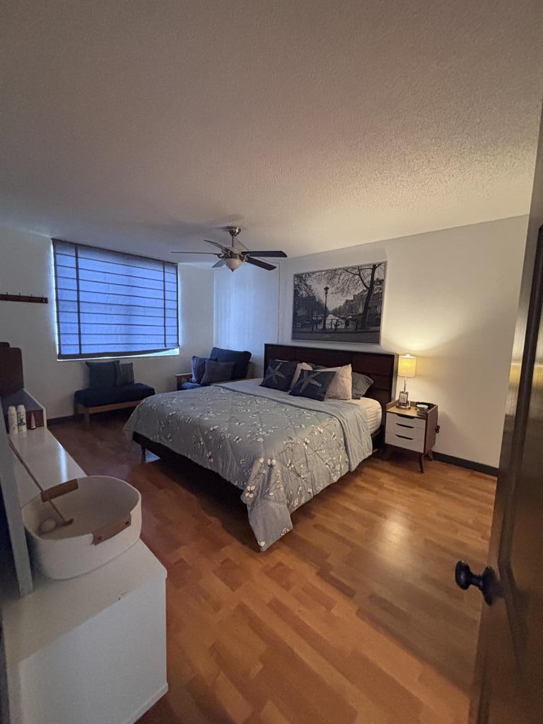 336 North Birch Road, Unit 8D Fort Lauderdale, FL 33304 - Photo 16 of 23 a bedroom with a bed and window