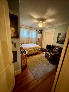a bed sitting in a room next to a window