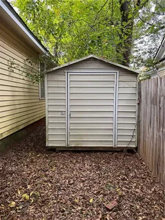 a side view of a house with a yard