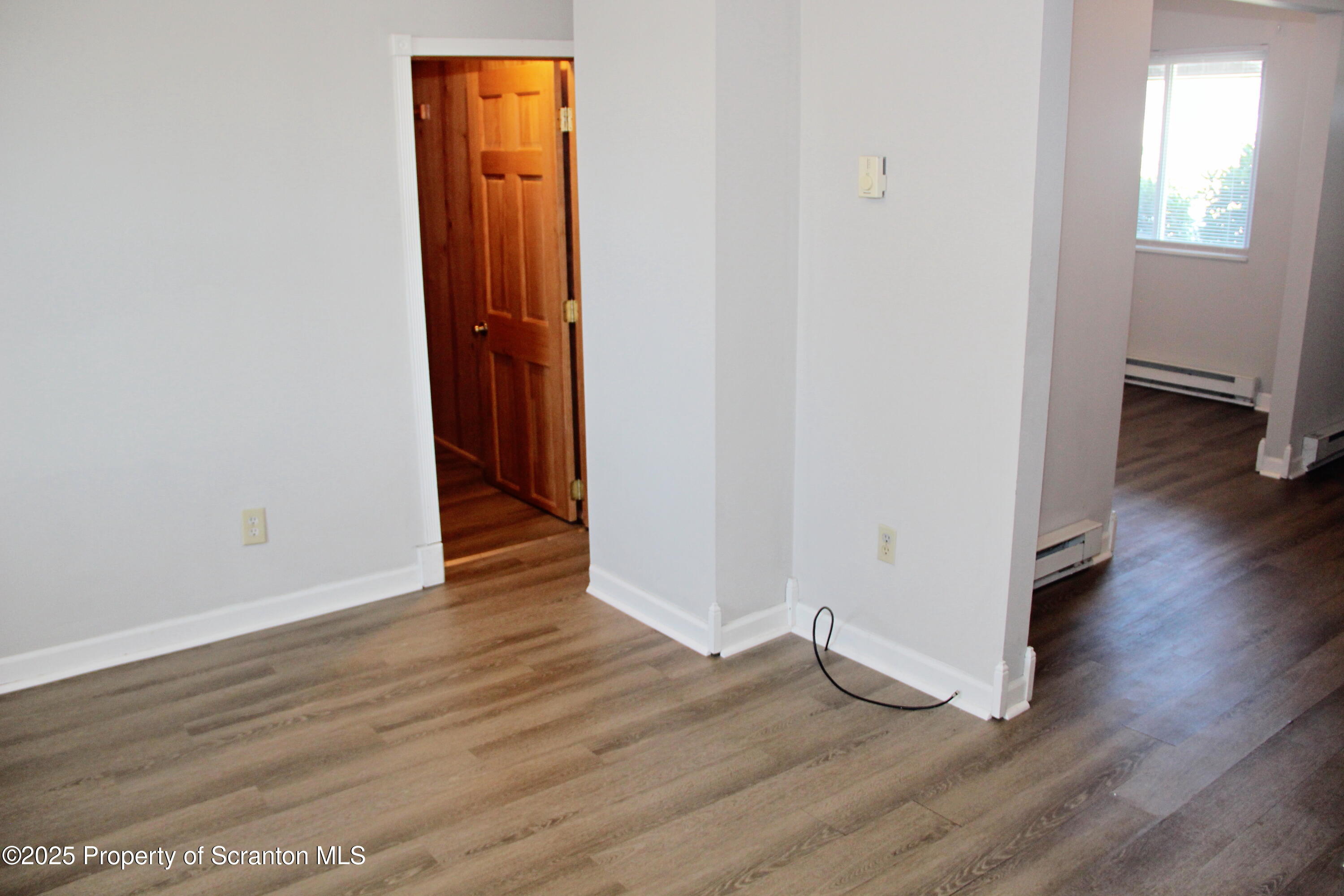 144 East Grace Street Old Forge, PA 18518 - Photo 11 of 17 an empty room with wooden floor and closet