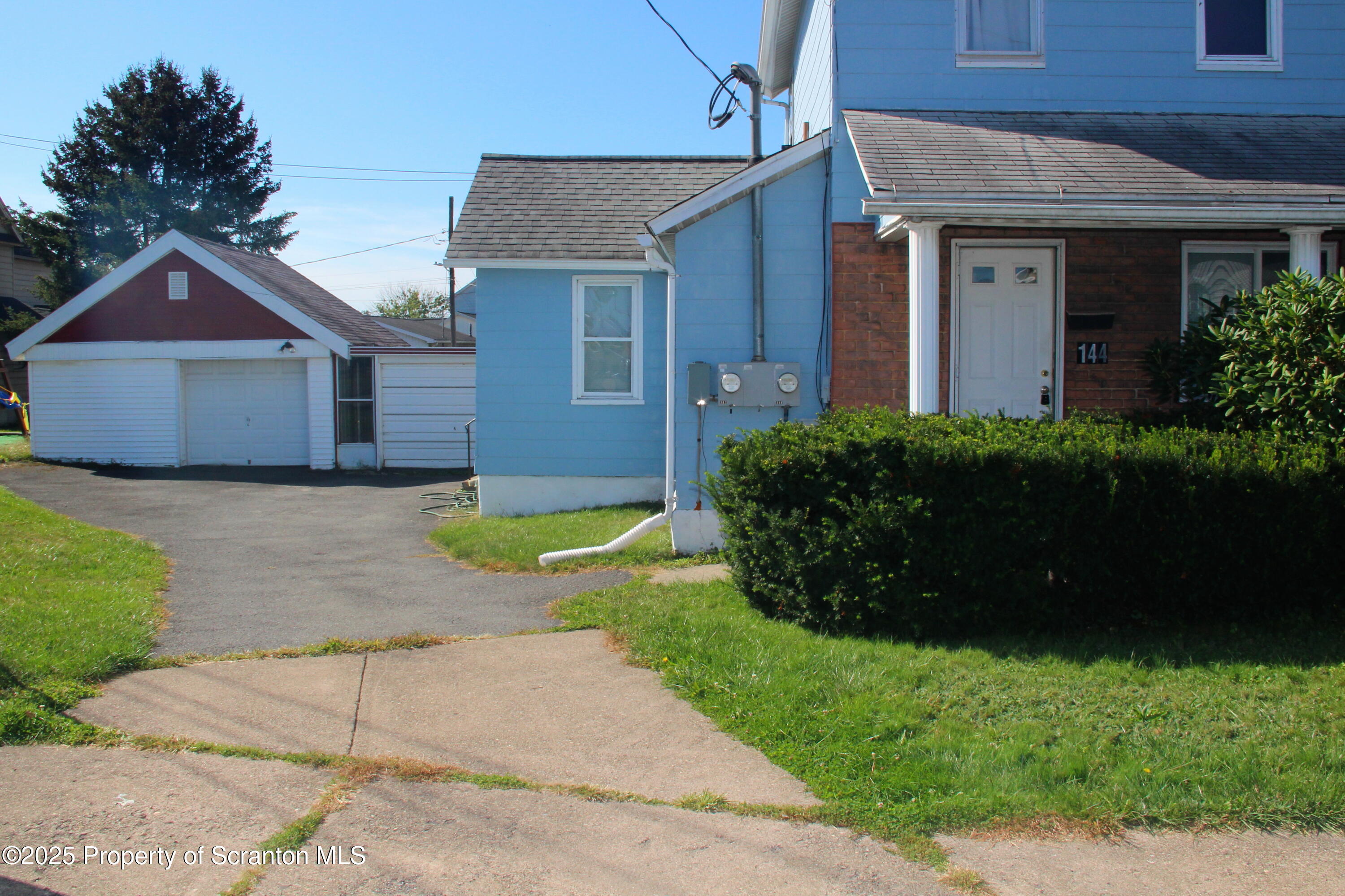 144 East Grace Street Old Forge, PA 18518 - Photo 2 of 17 a view of a house with a yard and large tree