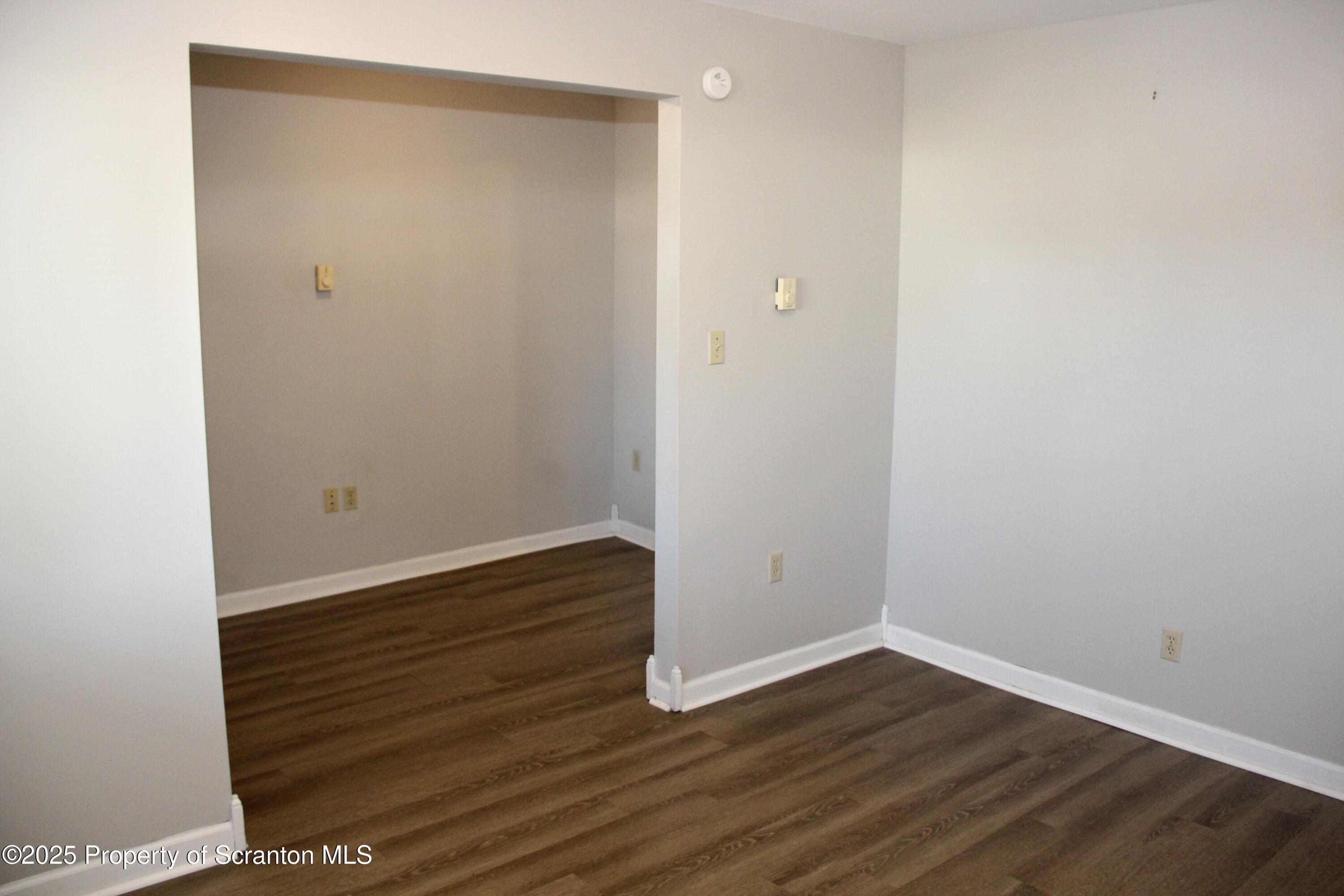 144 East Grace Street Old Forge, PA 18518 - Photo 7 of 17 a view of an empty room with wooden floor