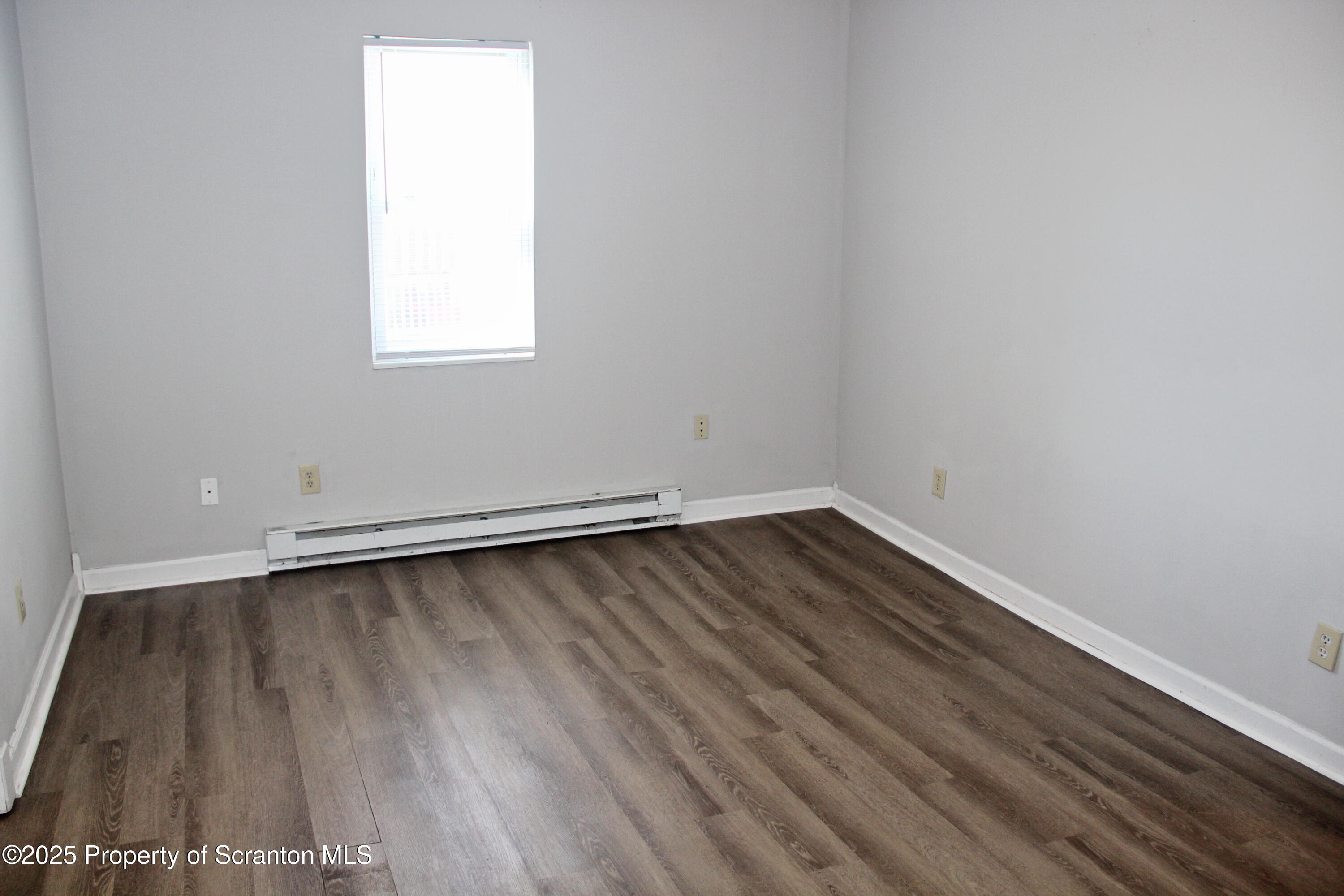 144 East Grace Street Old Forge, PA 18518 - Photo 9 of 17 a view of a room with wooden floor and window