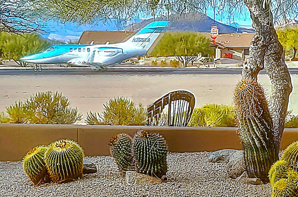8502 East Cave Creek Road, Unit 10 Carefree, AZ 85377 - Photo 1 of 44 a view of roof deck with furniture and wooden floor