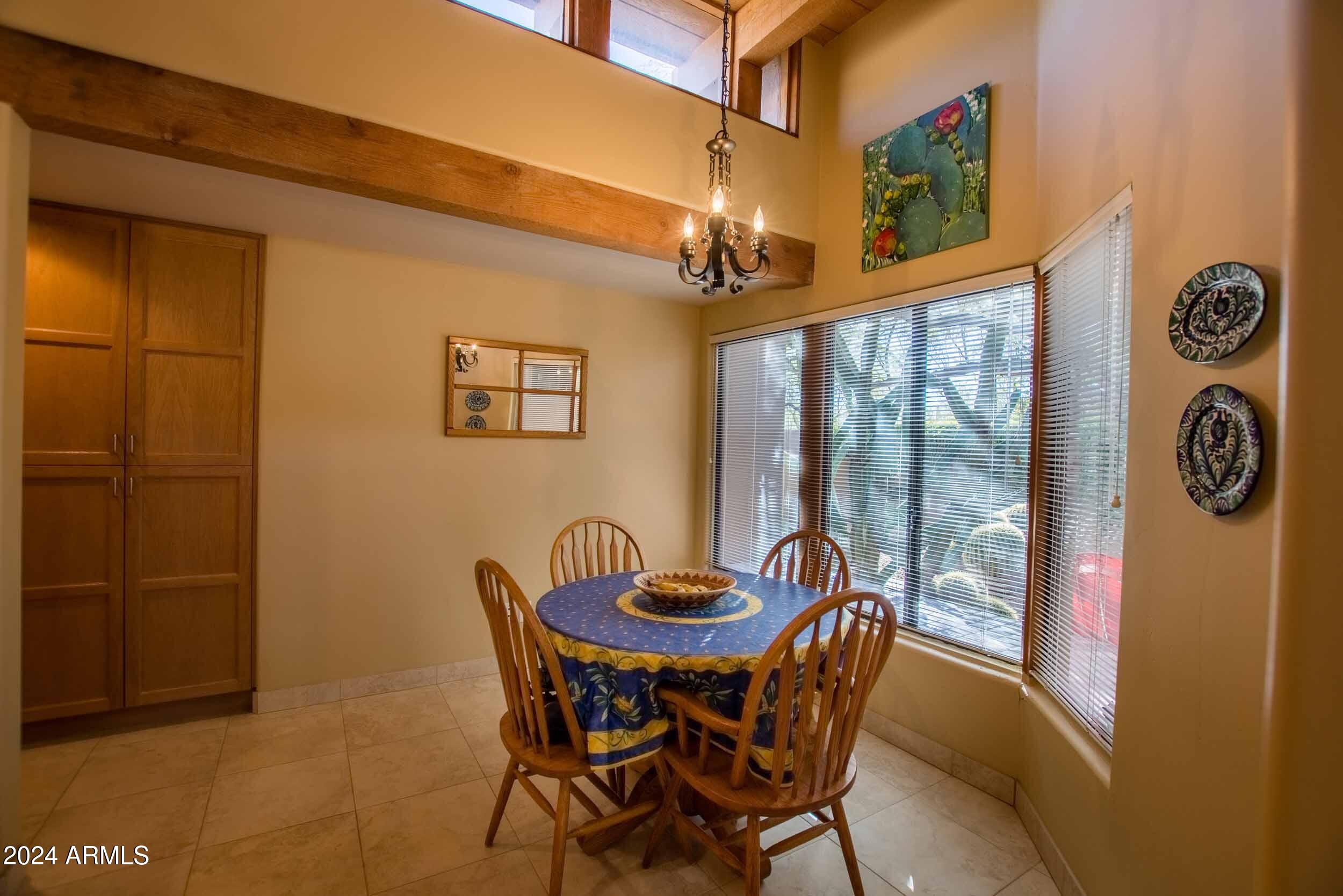8502 East Cave Creek Road, Unit 10 Carefree, AZ 85377 - Photo 23 of 44 a view of a dining room with furniture and window
