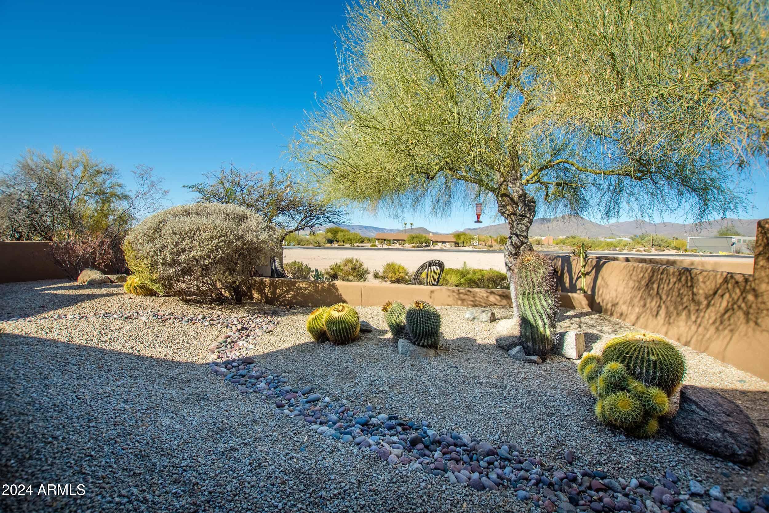 8502 East Cave Creek Road, Unit 10 Carefree, AZ 85377 - Photo 26 of 44 a view of a backyard with wooden fence
