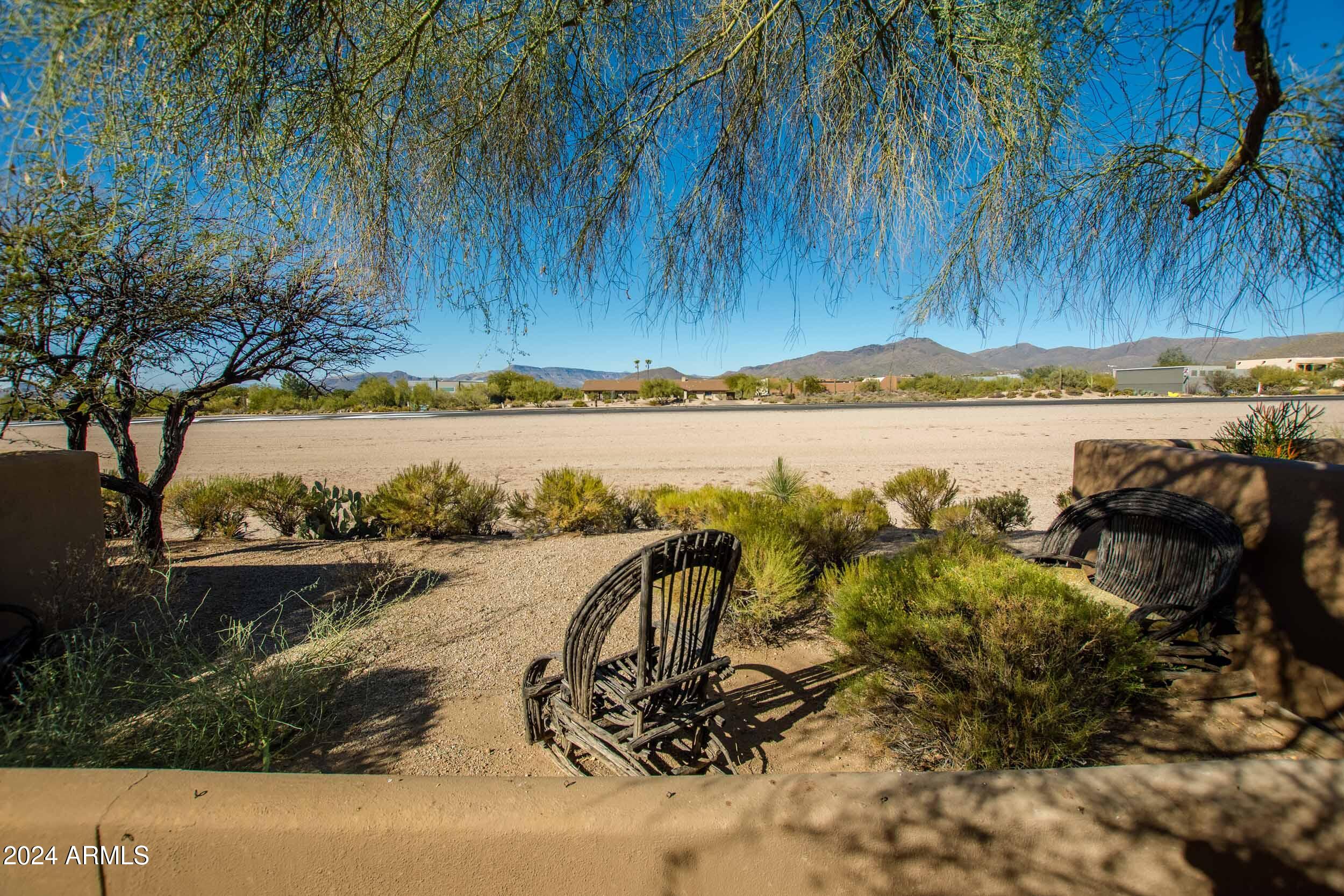8502 East Cave Creek Road, Unit 10 Carefree, AZ 85377 - Photo 28 of 44 a view of a lake with a yard