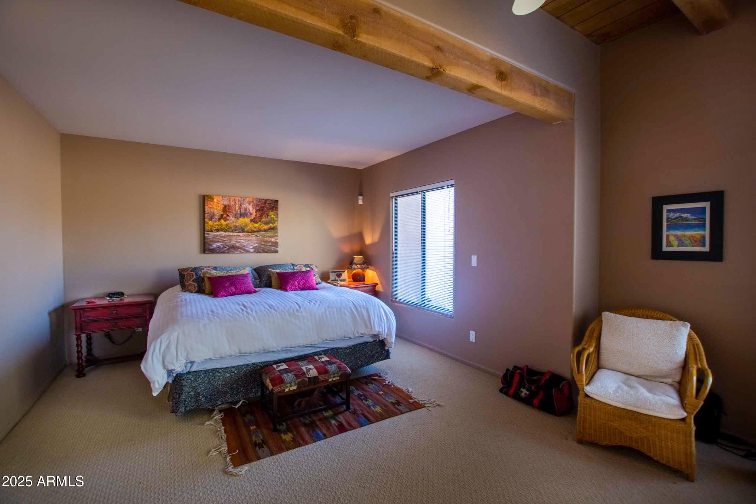 8502 East Cave Creek Road, Unit 10 Carefree, AZ 85377 - Photo 33 of 44 a bed room with a bed and a couch