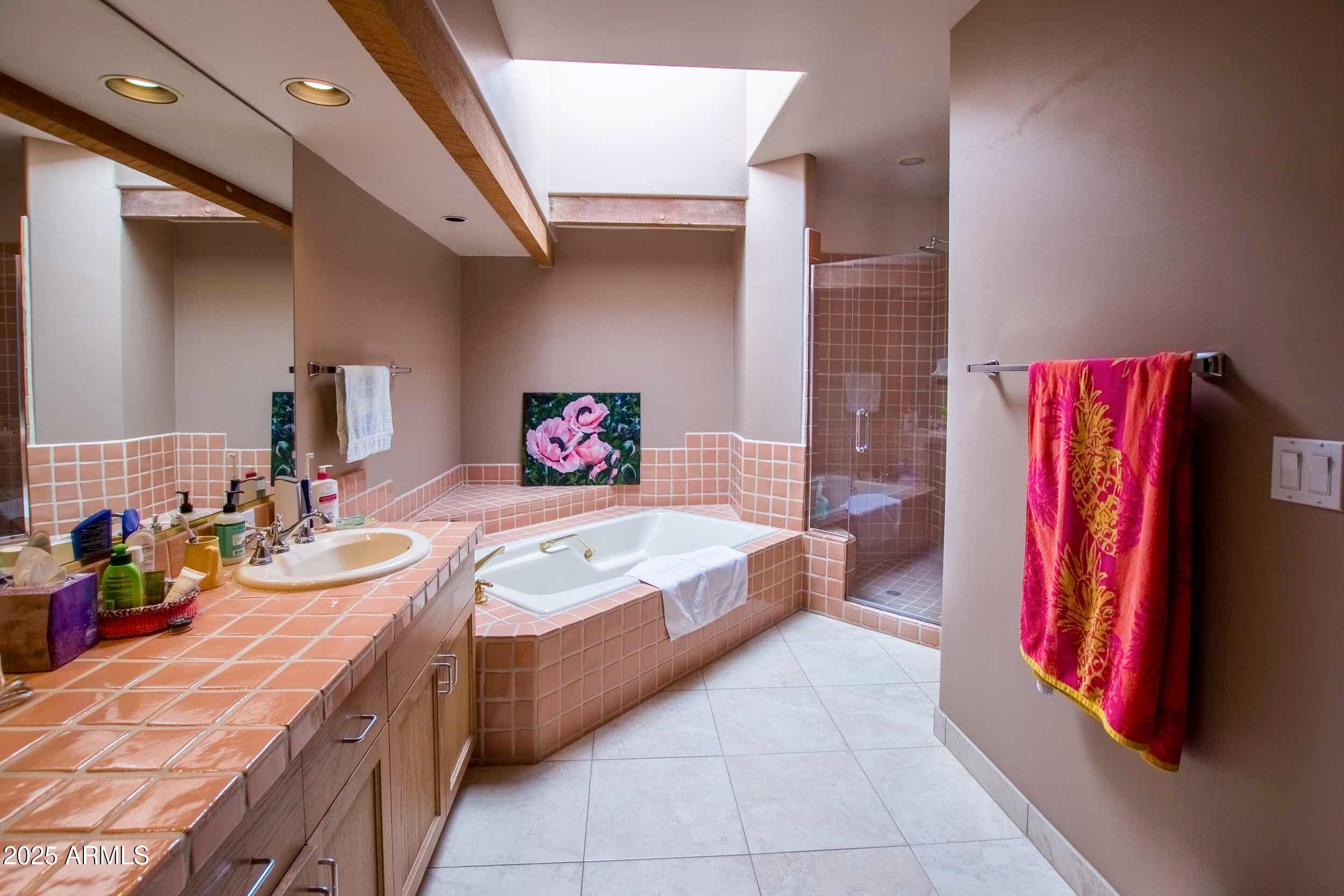 8502 East Cave Creek Road, Unit 10 Carefree, AZ 85377 - Photo 35 of 44 a bedroom with a bed and a chandelier