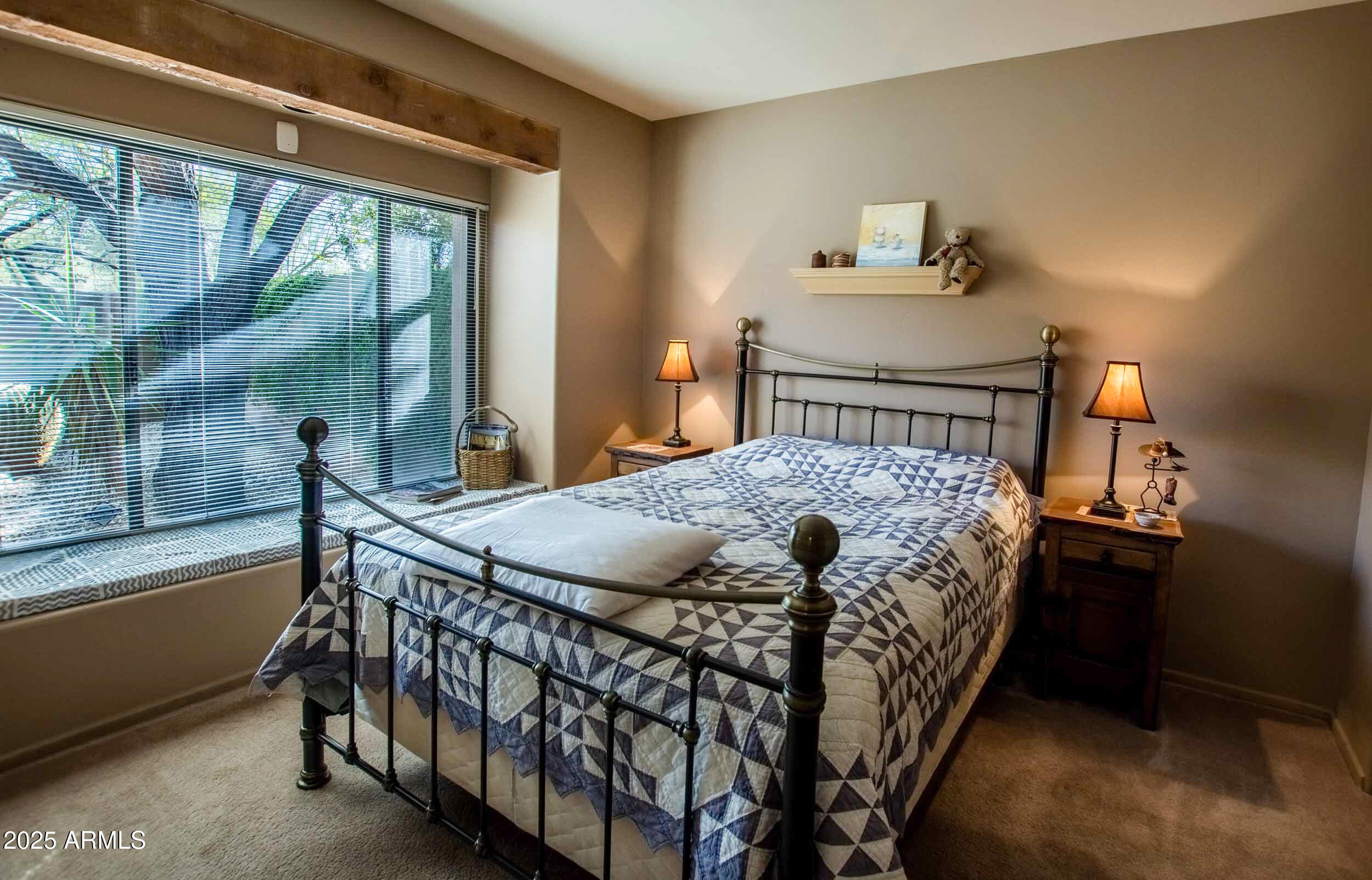 8502 East Cave Creek Road, Unit 10 Carefree, AZ 85377 - Photo 38 of 44 a bed sitting in a bedroom next to a window