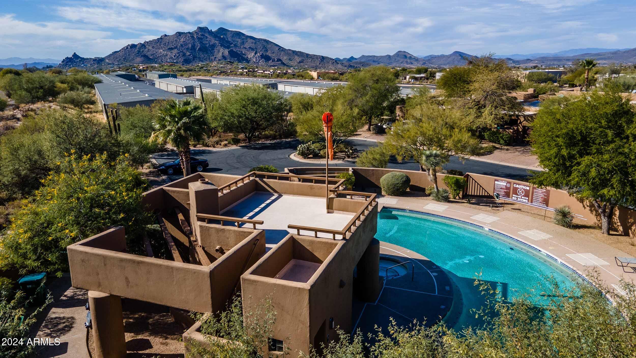 8502 East Cave Creek Road, Unit 10 Carefree, AZ 85377 - Photo 42 of 44 an aerial view of a house with a garden and lake view