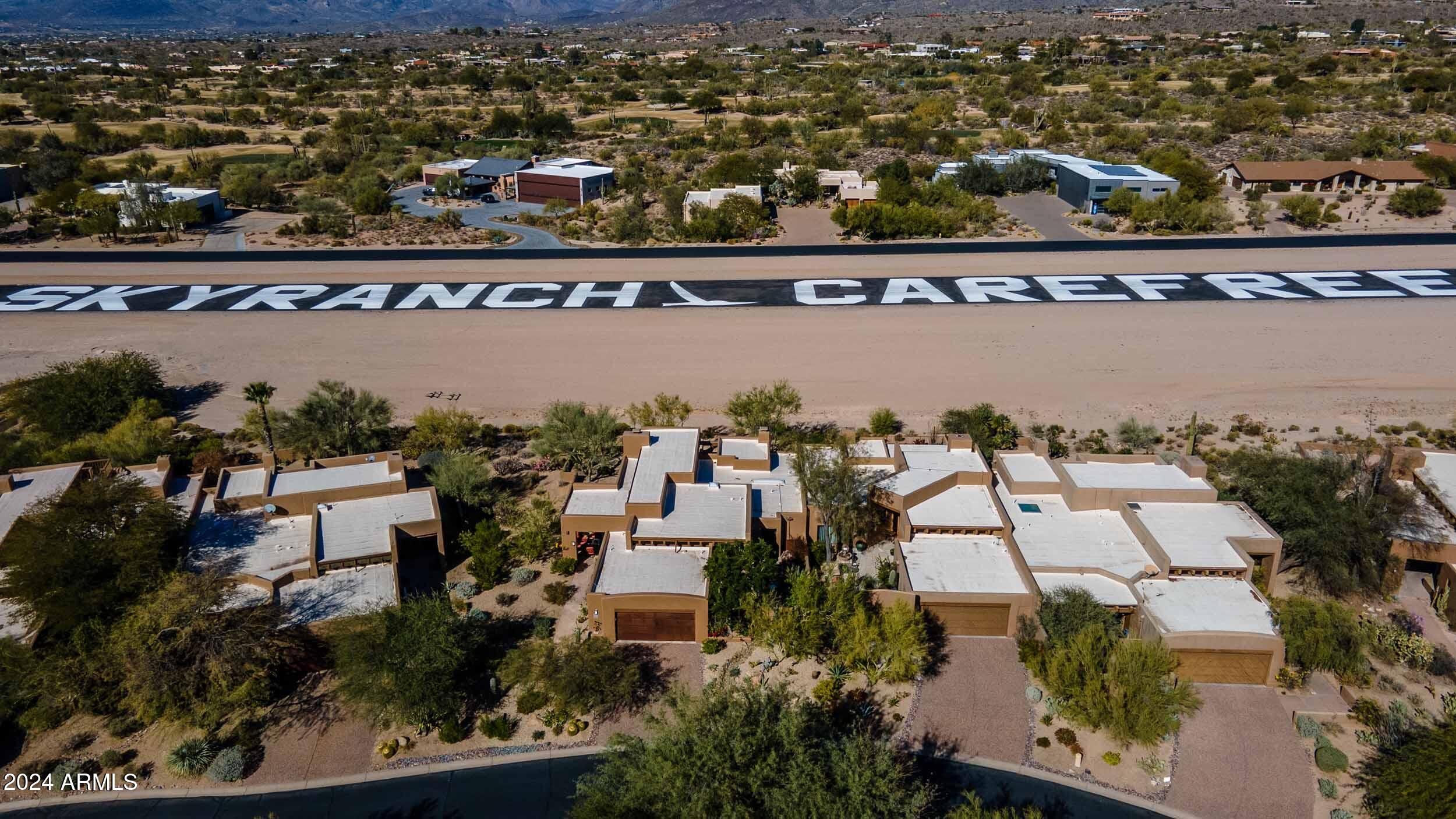 8502 East Cave Creek Road, Unit 10 Carefree, AZ 85377 - Photo 43 of 44 an aerial view of a residential houses