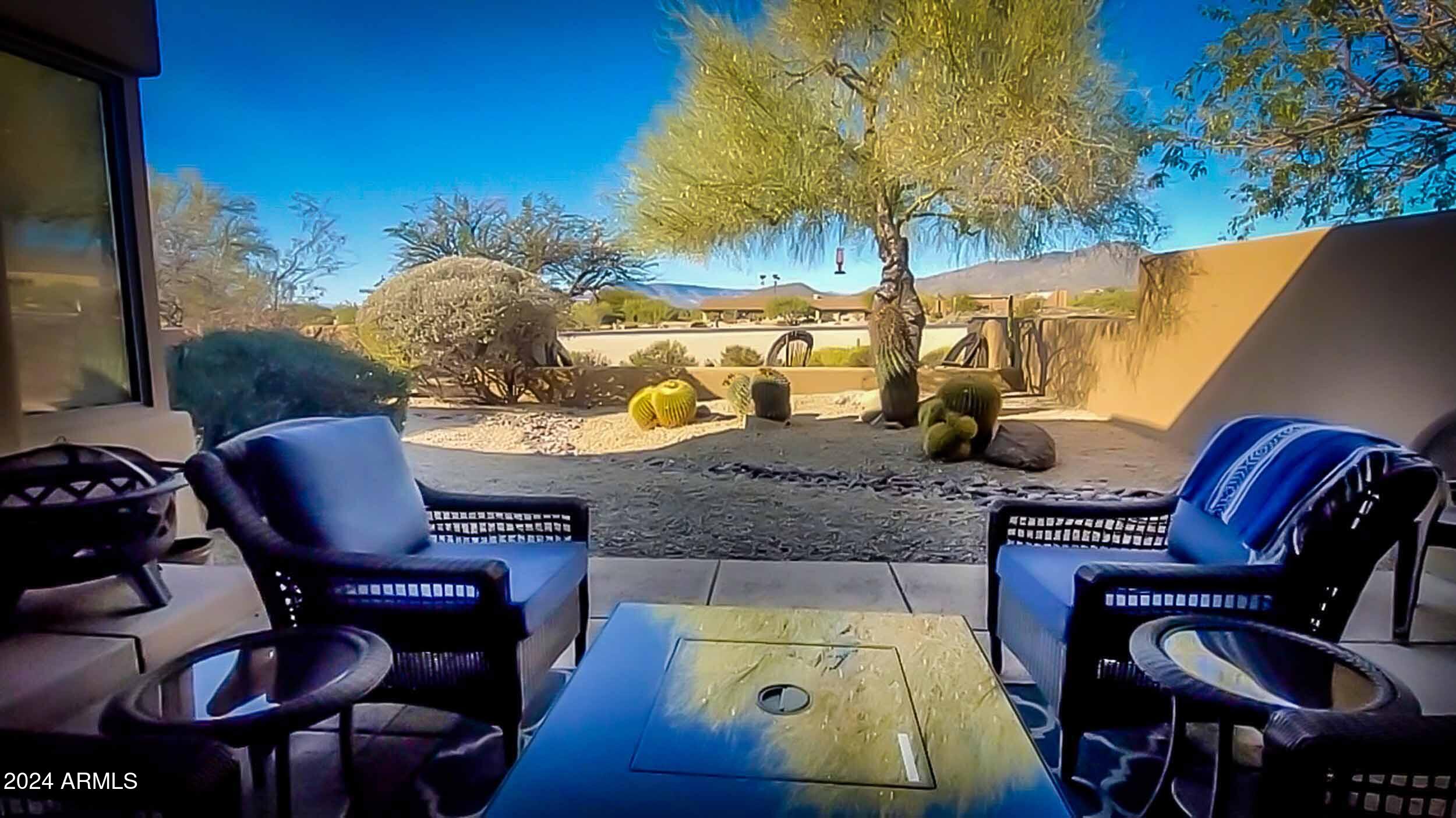 8502 East Cave Creek Road, Unit 10 Carefree, AZ 85377 - Photo 10 of 44 a view of a chairs and table in the patio