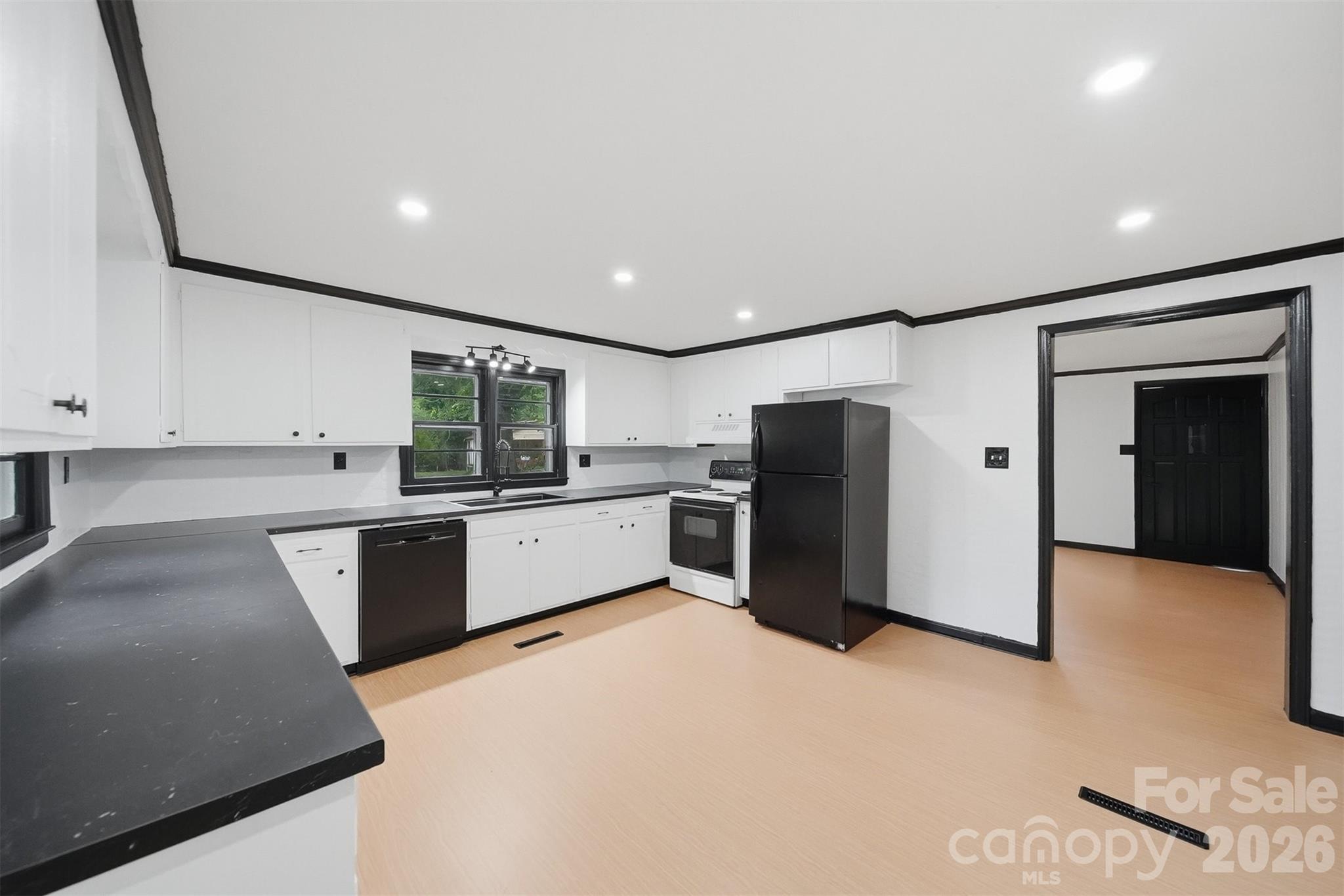 201 Cape Hickory Road Hickory, NC 28601 - Photo 2 of 16 a large kitchen with stainless steel appliances refrigerator sink and white cabinets