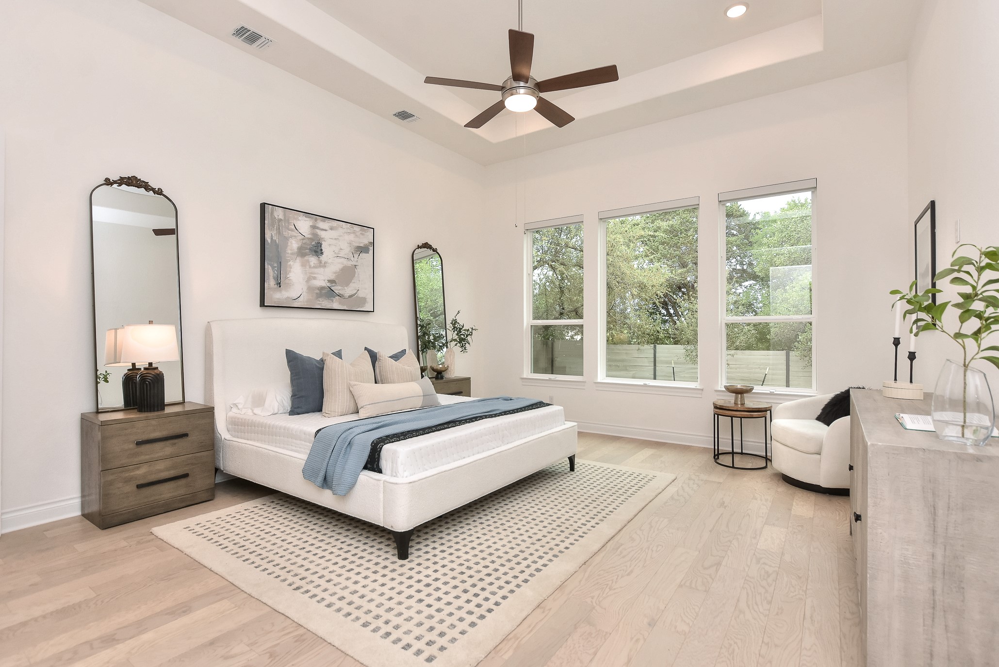 309 Wolf Rdg Road Georgetown, TX 78628 - Photo 15 of 39 Bedroom with a raised ceiling, light wood-type flooring, and a ceiling fan