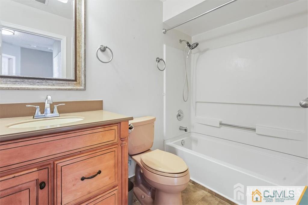 834 Edpas Road New Brunswick, NJ 08901 - Photo 3 of 20 a bathroom with a sink a toilet and shower