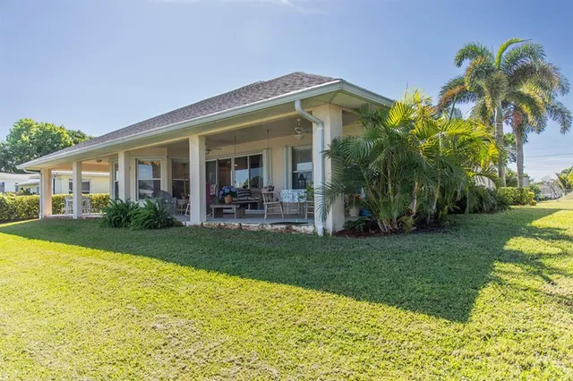 a view of a house with a swimming pool and a garden