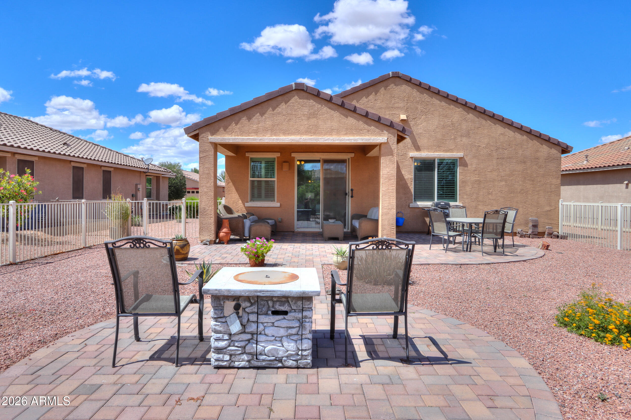 42085 West Cribbage Road Maricopa, AZ 85138 - Photo 30 of 35 a view of a patio with couches table and chairs and potted plants