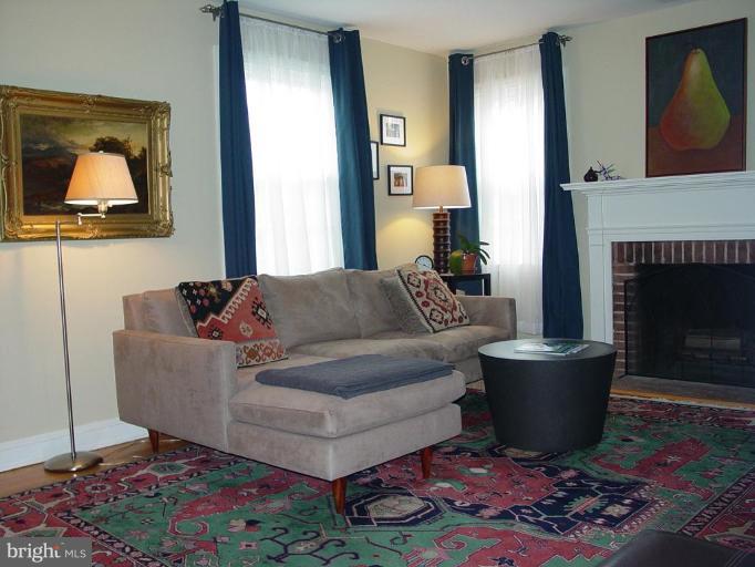 730 Overbrook Road Baltimore, MD 21212 - Photo 2 of 29 a living room with furniture and a fireplace