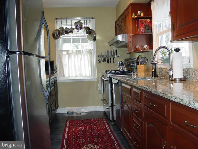 730 Overbrook Road Baltimore, MD 21212 - Photo 14 of 29 a kitchen with stainless steel appliances granite countertop a refrigerator and a sink