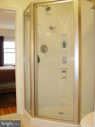 730 Overbrook Road Baltimore, MD 21212 - Photo 18 of 29 a bathroom with a glass shower door