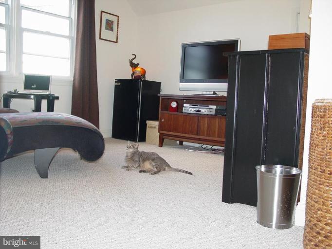 730 Overbrook Road Baltimore, MD 21212 - Photo 20 of 29 a bedroom with a bed and television