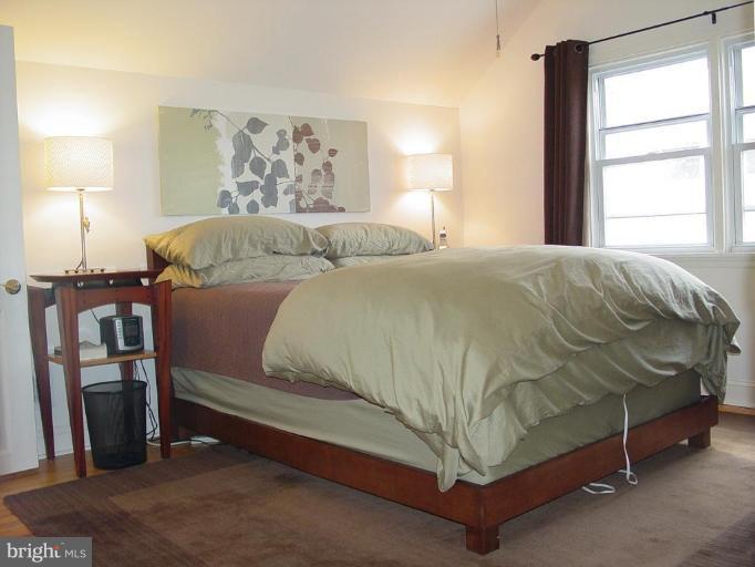 730 Overbrook Road Baltimore, MD 21212 - Photo 21 of 29 a bed sitting in a bedroom next to a window