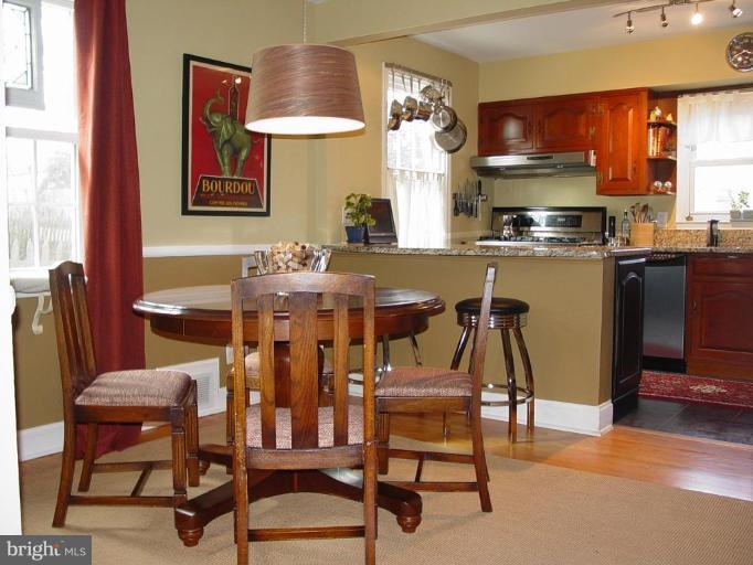 730 Overbrook Road Baltimore, MD 21212 - Photo 4 of 29 a view of a dining room with furniture and wooden floor