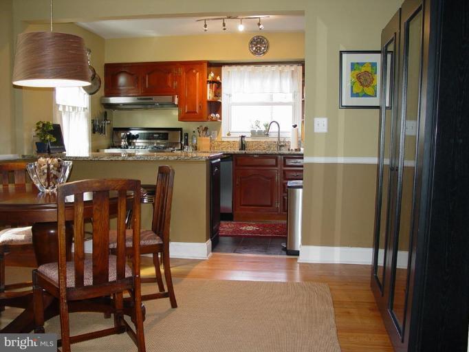730 Overbrook Road Baltimore, MD 21212 - Photo 5 of 29 a kitchen with a table and chairs in it