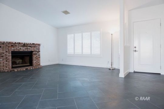 432 Ashton Street Ridgecrest, CA 93555 - Photo 5 of 31 an empty room with windows and fireplace