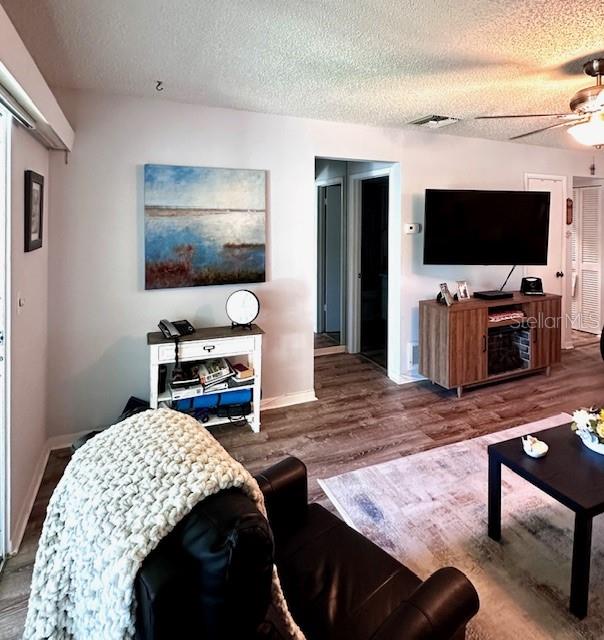 1701 Pinehurst Road, Unit 13C Dunedin, FL 34698 - Photo 11 of 28 a bedroom with furniture and a flat screen tv