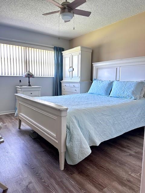 1701 Pinehurst Road, Unit 13C Dunedin, FL 34698 - Photo 13 of 28 a bedroom with a bed and window