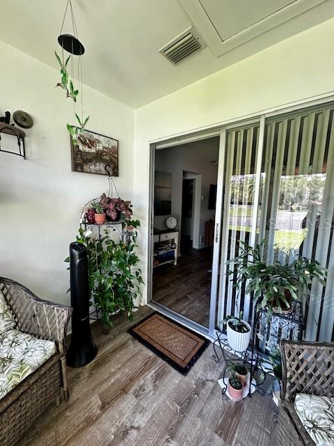 1701 Pinehurst Road, Unit 13C Dunedin, FL 34698 - Photo 19 of 28 a living room with furniture and flowers