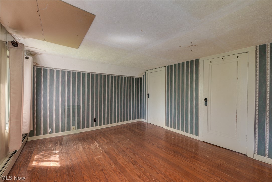 343 Bellus Road Hinckley, OH 44233 - Photo 32 of 49 Upstairs bedroom 1 with hardwood wood flooring.