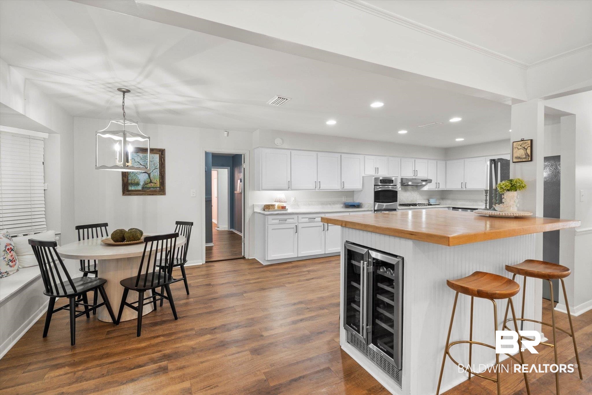 254 Woodlands Avenue Mobile, AL 36607 - Photo 7 of 50 Kitchen featuring butcher block counters, white cabinetry, a kitchen breakfast bar, hanging light fixtures, and recessed lighting