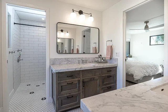 a view of an outdoor sitting area with brick walls